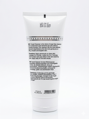 White facial cleanser tube with black text on a white background